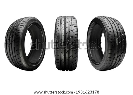 three new summer tires, isolate on a white background Royalty-Free Stock Photo #1931623178