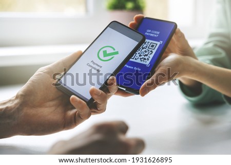 qr code payment - person paying with mobile phone Royalty-Free Stock Photo #1931626895