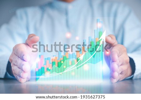 Businessman hand show Stock chart showing rising stock sign with graph indicator. Interest rate financial and mortgage rates concept. Double Exposure Image. Royalty-Free Stock Photo #1931627375