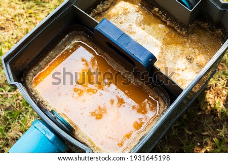 Grease traps box in the house, fats oils and grease.Concept waste water treatment Royalty-Free Stock Photo #1931645198