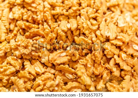Textured surface of dry walnut of the Juglandaceae family. Healthy food ingredient