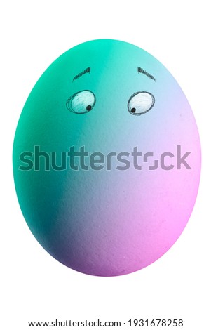 Large picture of an easter egg with eyes and rainbow colors.