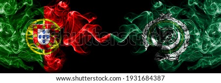 Portugal, Portuguese vs Arab League smoky mystic flags placed side by side. Thick colored silky abstract smoke flags.