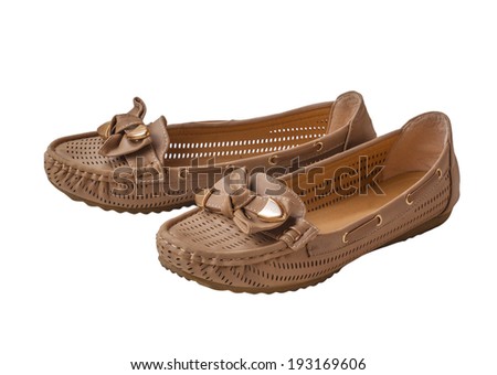 A pair of women beige moccasins isolated on a white background