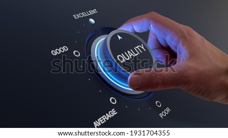 Selecting excellent quality to increase customer satisfaction. Quality assurance management and control for products or services. Concept with QA manager's hand turning knob. Royalty-Free Stock Photo #1931704355