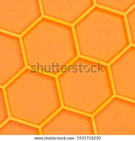 Honeycomb seamless pattern. Geometric hexagonal background. Yellow hexagon cells on orange background. Connection concept