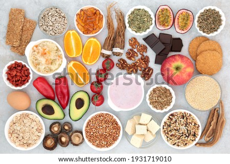 Health food and herbal medicine to help treat bipolar disorder and manic depression with foods high in omega 3, protein, vitamins, selenium, magnesium, serotonin and tryptophan. Health care concept Royalty-Free Stock Photo #1931719010