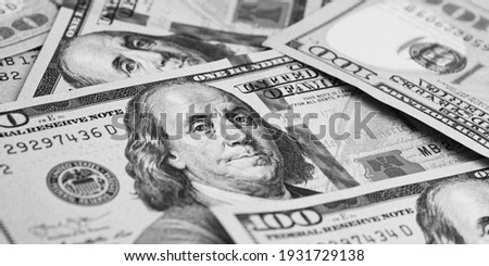 A hundred American banknotes are scattered. cash hundred-dollar bills, dollar background image.