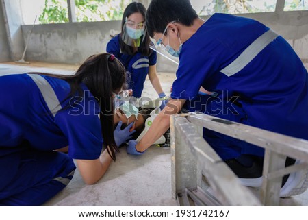 First aid for head injuries and Considered for all trauma incidents of worker in work, Loss of feeling or loss of normal movement and Loss of function in limbs, First aid training to transfer patient. Royalty-Free Stock Photo #1931742167