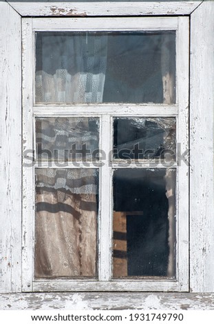 Old wooden window. Vintage frame texture with peeling paint. Royalty-Free Stock Photo #1931749790
