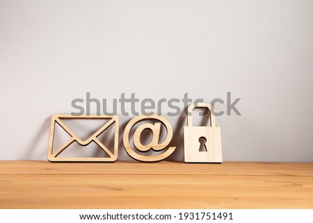 wooden lock with letter and mail sign on table