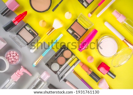Summer bright make up set. Various Fashion Cosmetic Makeup concept. Set of professional decorative beauty products tools and accessory. trendy yellow grey background flat lay top view