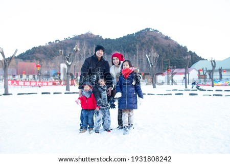family picture on the snowy village