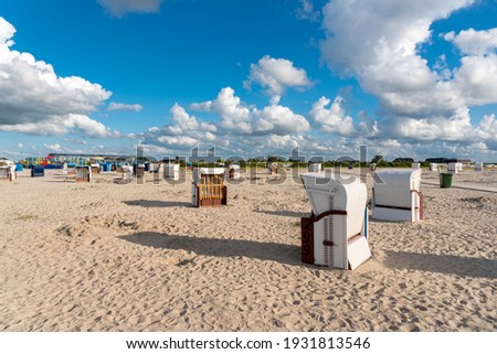 Beach with beach baskets in Harlesiel. Harlesiel is a holiday resort in East Frisia and is located on the North Sea coast in Germany. Royalty-Free Stock Photo #1931813546