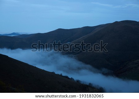 mountain in high altitude mountains in clouds and fog	
