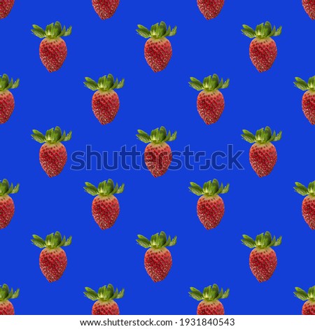 Seamless pattern with whole fresh beautiful red strawberries on solid bright blue background. Strawberries in rows.