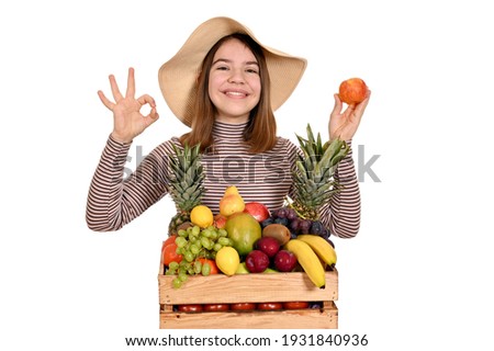 happy girl with apple and ok hand sign