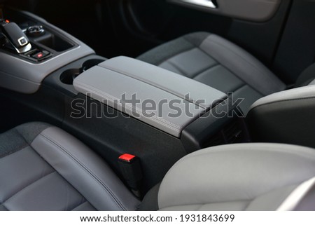 Armrest in the luxury passenger car between the front seats Royalty-Free Stock Photo #1931843699