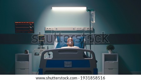 A dead man with an oxygen mask lies in a hospital bed Royalty-Free Stock Photo #1931858516