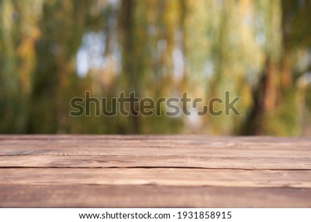 Empty wooden table nature bokeh background with a country outdoor theme,Template mock up for display of product Copy space