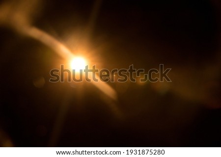 Abstract Natural Sun flare on the black Royalty-Free Stock Photo #1931875280
