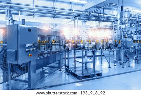 Beverage factory, Conveyor belt with bottles, food and drink production line process Royalty-Free Stock Photo #1931918192