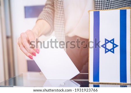 Parliament election concept. Hand putting ballot. Israel.