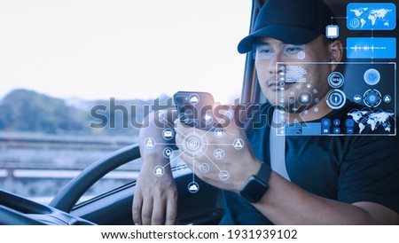 Asian man using smartphones check data digital. High-tech truck driver Find location 3D world map application touch screen display realistic. Transport, Delivery, and driving tracking technology. Royalty-Free Stock Photo #1931939102