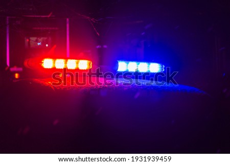 Abstract blurred background with flasher in the dark. Special signals of emergency services. Accident concept. Copyspace for text or inscription Royalty-Free Stock Photo #1931939459
