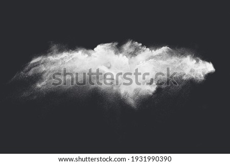 Abstract design of white powder snow cloud explosion on dark background Royalty-Free Stock Photo #1931990390