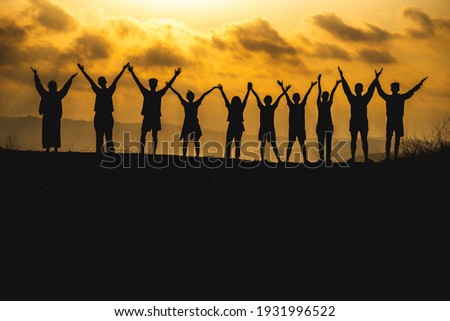 The silhouette of a business network group of business people shaking hands to express the joy and celebration of the success of the marketing and business operations between companies
