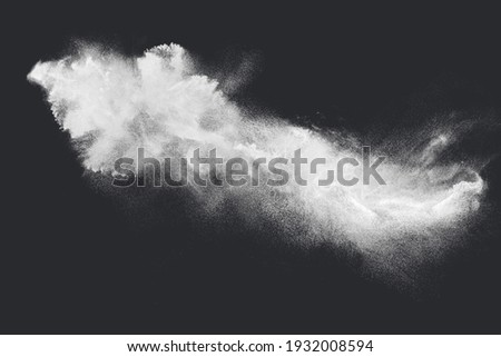 Abstract design of white powder snow cloud explosion on dark background Royalty-Free Stock Photo #1932008594