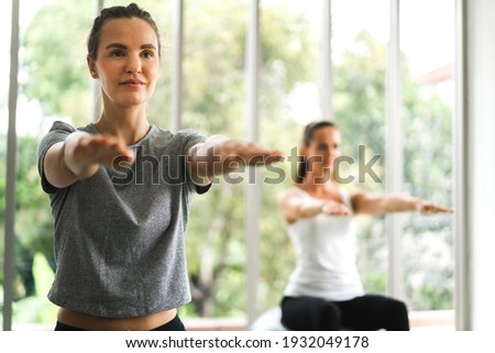 Portrait of sport attractive people woman in sportswear sitting relax and practicing yoga fitness exercise with blue fitball in class training at sport club.Diet concept.Fitness and healthy lifestyle