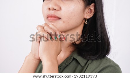 a Christian woman praying humbly isolated white background