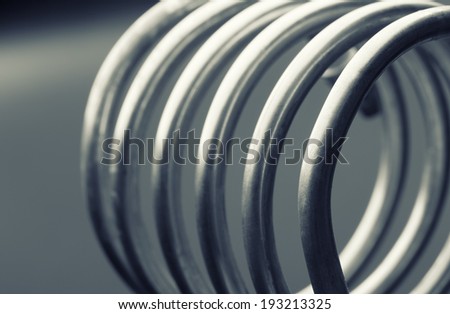 Aluminum spiral isolated on gray background