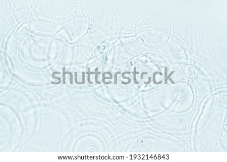 Clear water surface close up. Clean water with droplets, top view. Royalty-Free Stock Photo #1932146843