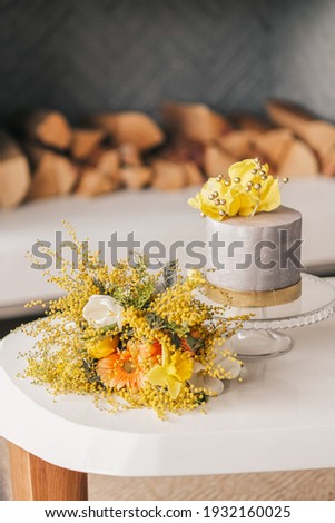 wedding cake and bouquet in the interior