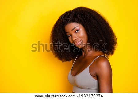 Photo of pretty positive woman flirty look camera wear grey singlet isolated yellow color background Royalty-Free Stock Photo #1932175274