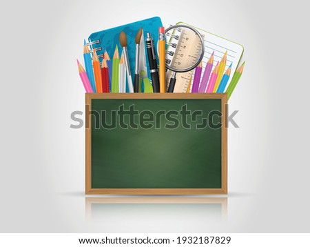 School design with a green textured chalkboard with free space for text and education supplies behind it - pens, pencils, markers, notebook, spy glass, ruler, sheet of paper, brushes. Royalty-Free Stock Photo #1932187829