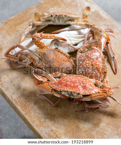 Hot Steamed Blue Crabs on wooden table.