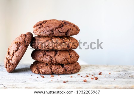 Fresh homemade chocolate chip cookies on a wooden background. Royalty-Free Stock Photo #1932205967
