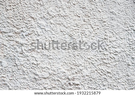 Old wall with peeling plaster, grunge background