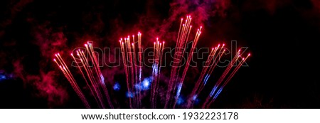 Explosion of fireworks rockets. The fiery tails of comets. Details and elements of outer space. Smoke and gas of stars. Royalty-Free Stock Photo #1932223178