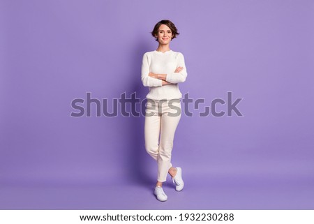 Full length body size photo of confident young business woman with crossed hands isolated on vivid purple color background