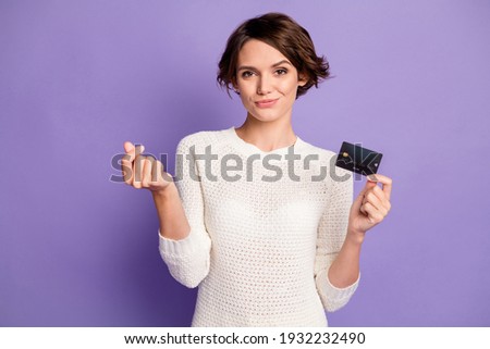 Photo portrait of brunette doing cashless purchase bank card isolated on bright violet color background