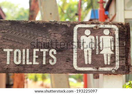 Symbolize  toilets on the wooden floor.