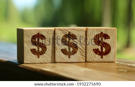 wooden cubes with US dollar sign .Investment and saving concept.
