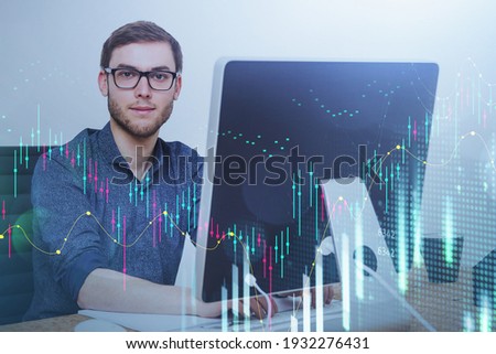 Office man in eyeglasses, digital graph rising and falling. Desktop display in business office, corporate communication, stock market changes on foreground