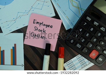 Employee Stock Option write on sticky notes isolated on Wooden Table. Selective focus on Employee Stock Option text