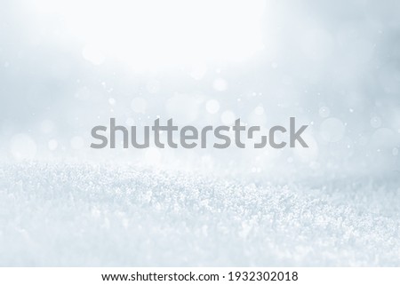 COLD SILVER ICE BACKGROUND WITH SOFT BOKEH LIGHTS, FROSTY WINTER BACKDROP FOR MONTAGE PRODUCTS AND CHRISTMAS PRESENTS Royalty-Free Stock Photo #1932302018